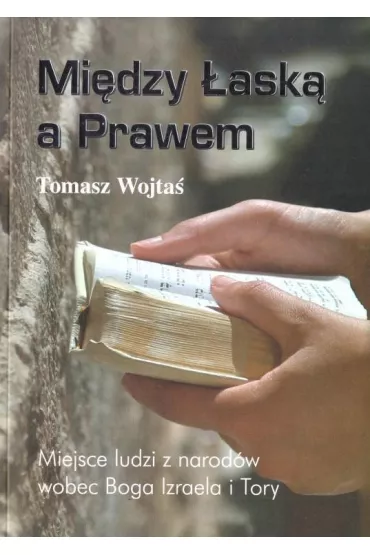 Mi�dzy �ask� a Prawem - Tomasz  Wojta�