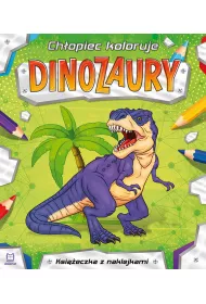 Ch�opiec koloruje. Dinozaury
