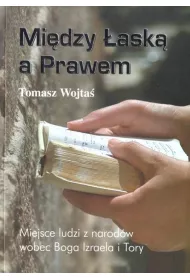 Mi�dzy �ask� a Prawem