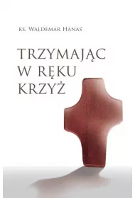 Trzymaj�c w r�ku krzy�